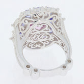 Intricate design of an oval pink topaz sterling silver ring showcasing elegant filigree details.